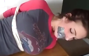 College girl is hogtied barefoot and ball-gagged