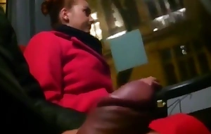 Juvenile woman near a red coat mainly a bus