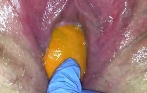 Tight pussy milf acquires her pussy on the blink with a orange and big apple popping it out of her tight hole making her squirt